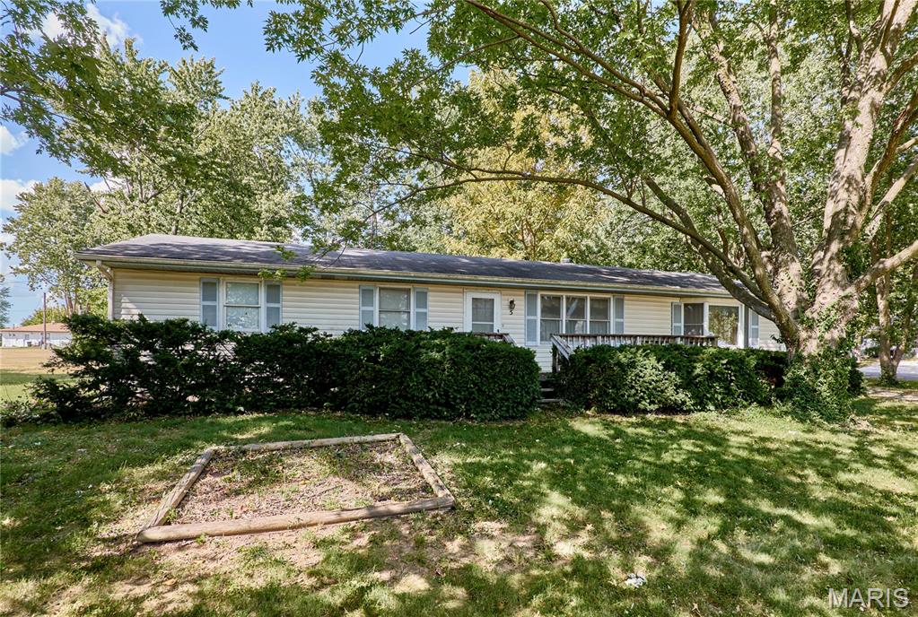 Spacious 3 bedroom home on a double lot with an extra adjoining parcel!

Great backyard setup with a lot of possibilities  for a workshop, garage, garden, or play equipment for the kids. Includes a large, partially fenced yard with a metal storage shed, front and back decks, and a big circle driveway with plenty of parking.

Inside, the large living room has a cozy brick gas fireplace and a bay window that lets in lots of natural light, plus a separate dining room.

The kitchen has plenty of cabinets, a Lazy Susan cabinet, a central island with outlets, a long breakfast bar with built-in lights, and a tall pantry with custom roll-out wooden shelves.

The huge walk-out basement has lots of outlets if you want a home office. There is also a unique hall closet upstairs with a floor drop-down chute that goes straight to a laundry rack in the basement.

The central air is only about 5 years old, and all appliances stay—including the stove/oven, additional wall oven, fridge with ice/water, dishwasher, microwave, washer, dryer, and upright deep freeze.

Property sold strictly "AS-IS" and "Where-IS". Inspections are for buyer information only. The seller will not make any repairs.