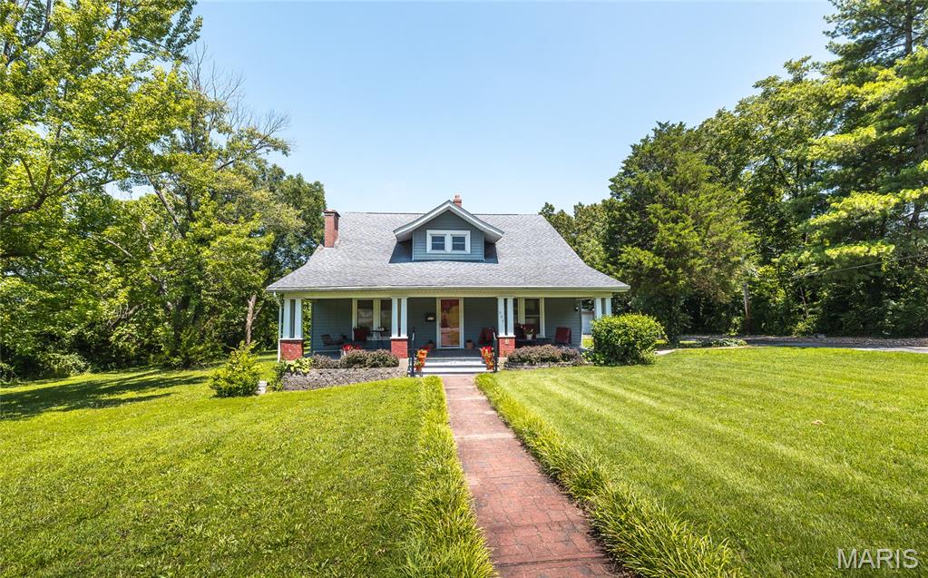 This Craftsman Home is a Cuba gem, and on the Historic Register! So when was it buildt? Some say 1906 by Major Luther Smith, the abstract says he became owner in 1913, all Iknow for sure is it is a beautiful home sitting on 1 acre in town.  The front porch is a wonderful space to relax and read. Inside you have traditional floor plan with formal sitting room with fireplace, large living room, formal dining room. There are coffered ceilings, historic millwork, 11 ft ceilings, wood staircase. The bathrooms have been updated, there are built-in, bonus rooms, and large closets. Well built sturdy home that is rich with history. The yard is beautiful with 2 car oversized garage. Let's take a look and you can write the next chapter!!!