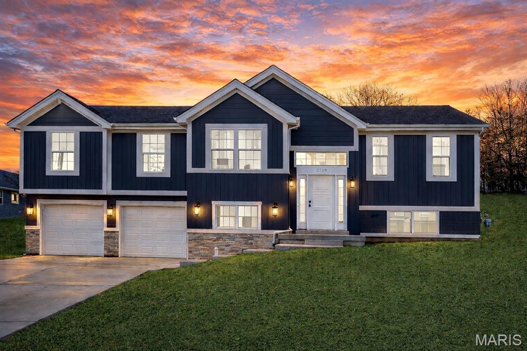 New Homes in New Haven - This popular plan is modern, inviting and inviting.  Upgraded hard surface flooring throughout the common areas of the home, upgraded lighting, and modern black hardware.  Vaulted ceilings in the great room and kitchen.  Huge island kitchen with plenty of room for seating in an L shaped design.  Step out onto your back patio and spacious backyard that backs to trees.  
This home is walkable to the city park and school.
New Haven, Missouri is a small town on the Hwy 100 corridor along the Missouri River - just 10 minutes to Washington and a small town vibe are just a few of the reasons residents love living here.  Enjoy a slower pace in a beautiful community. 

Northern Star Homes - your hometown builder.