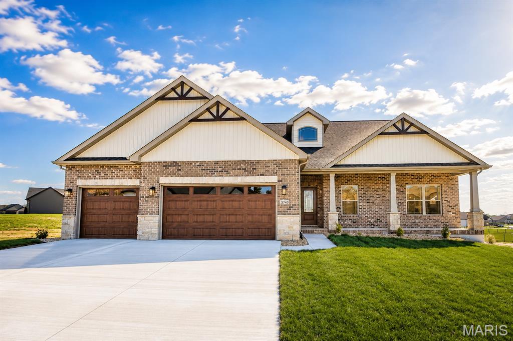 Stunning French-inspired Devonshire by CNR Homes offering beautiful golf course views and over 3,000 square feet of thoughtfully designed finished living space. This exceptional 4-bedroom, 3.5-bath home showcases quality craftsmanship and upscale finishes throughout, including a finished lower level and oversized three-car finished garage.

The open-concept main level is filled with natural light and features soaring vaulted ceilings, luxury flooring, and a spacious great room anchored by a cozy gas fireplace. The designer kitchen is the heart of the home, complete with quartz countertops, an oversized center island, custom range hood, staggered cabinetry, built-in pantry shelving, and premium finishes that seamlessly flow into the dining and living spaces—perfect for everyday living and entertaining.

Retreat to the private primary suite featuring a tray ceiling, spa-inspired bath with dual vanities, a freestanding soaking tub, oversized tiled walk-in shower, and an impressive custom walk-in closet.

The finished lower level expands your living space with a massive family room, fourth bedroom, full bath, and abundant storage, making it ideal for guests, recreation, or a home theater.

Step outside to enjoy the oversized covered front porch and spacious covered patio overlooking peaceful golf course views. Nestled near the back of the community, this home offers the perfect blend of privacy, luxury, and scenic surroundings while showcasing the exceptional quality and attention to detail CNR Homes is known for.