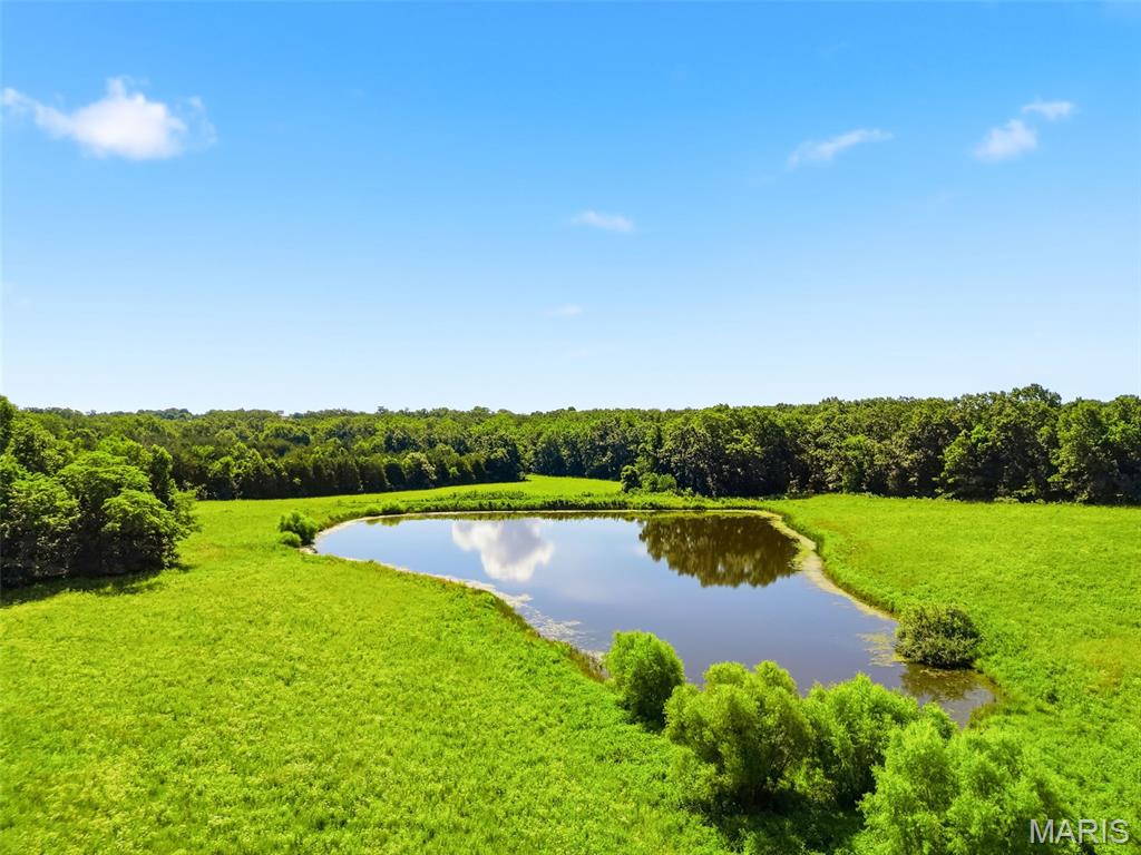 85+/- ACRES - PRIME DEVLOPMENT OPPORTUNITY ADJOINING WARRENTON CITY LIMITS!!! Discover the exceptional potential of this 85.26 acre tract ideally located just outside the Warrenton city limits. Featuring predominantly open, level to gently rolling terrain with scattered wooded areas, this property offers excellent visibility and versatility for a variety of uses. Whether envisioned as a residential subdivision with estate-sized or smaller homesites, a private retreat, or an agricultural operation, the possibilities are extensive. Conveniently situated only 2 miles from I-70 and approximately 1 mile from downtown Warrenton, the property provides quick access to shopping, dining, schools, and other local amenities. Existing home and outbuildings are considered to have no contributory value & has a current rental lease with an approximate end in February 2027. According to the previous owner, Warrenton indicated that public water and sewer services may be available upon annexation, creating additional development potential. Opportunities of this size, location, and flexibility are increasingly rare.