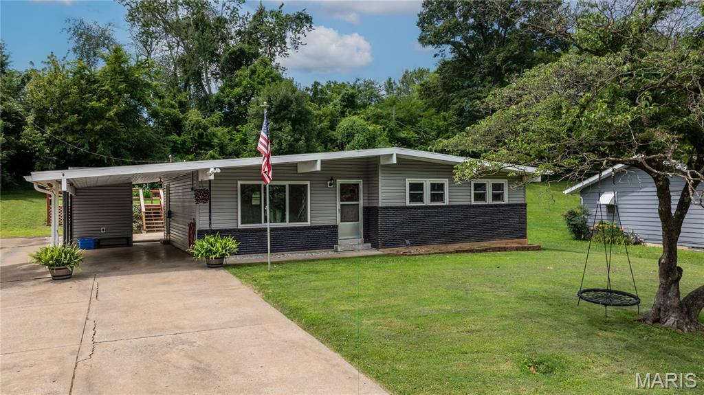 Mid-Century Modern lovers—this one is for you. Clean architectural lines, original character, a wood-burning fireplace, warm natural wood accents, and an open-concept layout create a style that's becoming increasingly hard to find in Jackson—especially at this price. Thoughtful updates preserve the home's timeless charm while giving you peace of mind, including a new Mid-Century-inspired rubber roof and new siding (2026), 5-year-old HVAC and water heater, and a professionally cleaned chimney in 2025. Move right in and enjoy the perfect blend of authentic character and modern updates. Unlike many homes from this era, this one has been thoughtfully maintained and updated while preserving the architectural details that make Mid-Century Modern homes so desirable.
