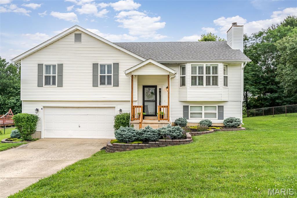 Beautifully maintained split-level residence situated on a spacious, level lot in the highly desirable College Hill Estates subdivision. Ideally located in the heart of Union, you'll enjoy convenient access to highways, hospitals, shopping, dining, schools, East Central College, parks, and everyday amenities.

Offering 4 bedrooms, 3 full bathrooms, and approximately 10 rooms of versatile living space, this home is designed to accommodate a variety of lifestyles. The main level features beautiful original hardwood floors, generously sized rooms, and a functional layout that's perfect for both daily living and entertaining.

The primary suite provides a relaxing retreat and features two closets for ample storage, along with an updated ensuite bath highlighted by a skylight installed in 2023 that fills the space with natural light. Three recently updated bathrooms throughout the home add modern appeal and convenience.

The finished lower level significantly expands your living space with a large family room, full bathroom, and fourth bedroom. This flexible area could easily serve as a guest suite, recreation room, home office, workout space, or even a potential fifth-bedroom setup.

Step outside to enjoy the beautiful level backyard and spacious deck, ideal for morning coffee, evening relaxation, or hosting family and friends. The attached two-car garage offers ample storage and utility space, while the separate side entrance adds convenience and functionality. Additional driveway parking provides plenty of room for guests.

Major updates include a roof approximately 3 years old, water heater approximately 5 years old, HVAC system approximately 10 years old, and low-maintenance vinyl siding. Public water, sewer, and electric services are in place, and the dishwasher, disposal, stove, and refrigerator all stay with the home.

Combining space, flexibility, updates, and an exceptional location, this move-in-ready home offers everything you've been searching for in one of Union's most established neighborhoods.