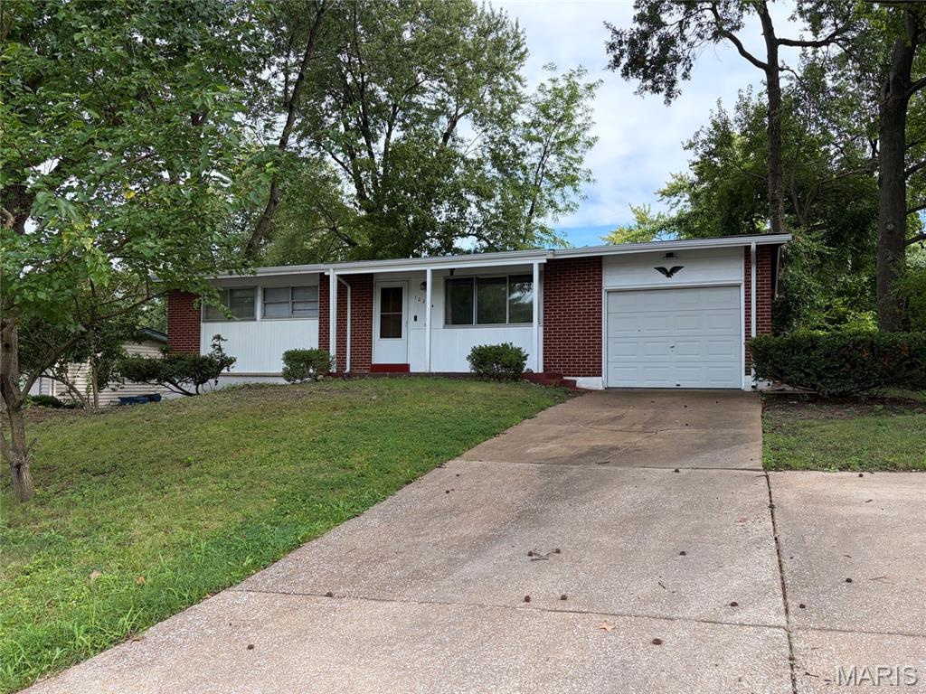 PRICE REDUCED!! Discover the inviting single-family residence at 10204 Dacey DR, DLLWD MO 63136, a ready-to-move-in home built in 1959 that seamlessly blends classic charm with modern living. This property offers a compelling opportunity for a vibrant lifestyle. This ranch-style home features three comfortable bedrooms, providing ample private space for relaxation and rejuvenation. With one NEWLY REMODELED MAIN FLOOR bathroom, convenience and comfort are prioritized for residents and guests alike. An attached one car oversized garage provides practical storage and secure parking. Embrace the opportunity to make this delightful property your own and schedule a private viewing today. Additional features include NEW ROOF, GUTTERS, and DOWN SPOUTS, new carpet in large living room and hallway, hardwood flooring in all of the bedrooms, large eat-in kitchen with custom cabinetry and vinyl tiled flooring, additional off-street parking to accommodate 3 autos, covered front porch, fenced backyard and full basement to remodel and enjoy.  The basement has a functional toilet and sink for convenience.  Come take a look at this extremely nice all brick home waiting for its new owners.