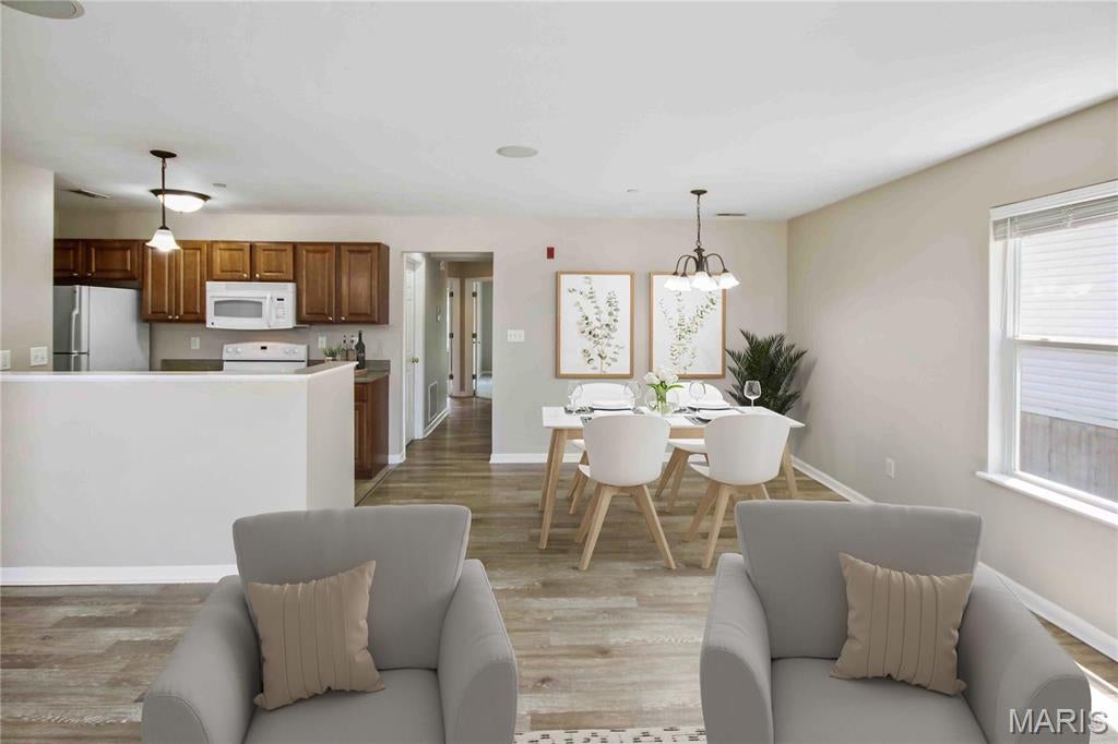 Beautiful 2 bed/2 bath first floor Dardenne Prairie condo with 1 car oversized garage and large storage space. The open floor plan features living/dining combo and kitchen with refrigerator, dishwasher, new smooth top electric range, and microwave. The primary bedroom includes a full bath, walk-in closet, and sliding glass door to private balcony. The laundry room comes with washer & dryer. The basement features a large storage room (10'x15') and over-sized (21'x11') 1 car private garage with opener. This home is pet-friendly with $30/month pet rent/pet a $200 pet fee/pet and features a community dog park. Tenant responsible for electric, water, and sewer. Security deposit equal to one month's rent.