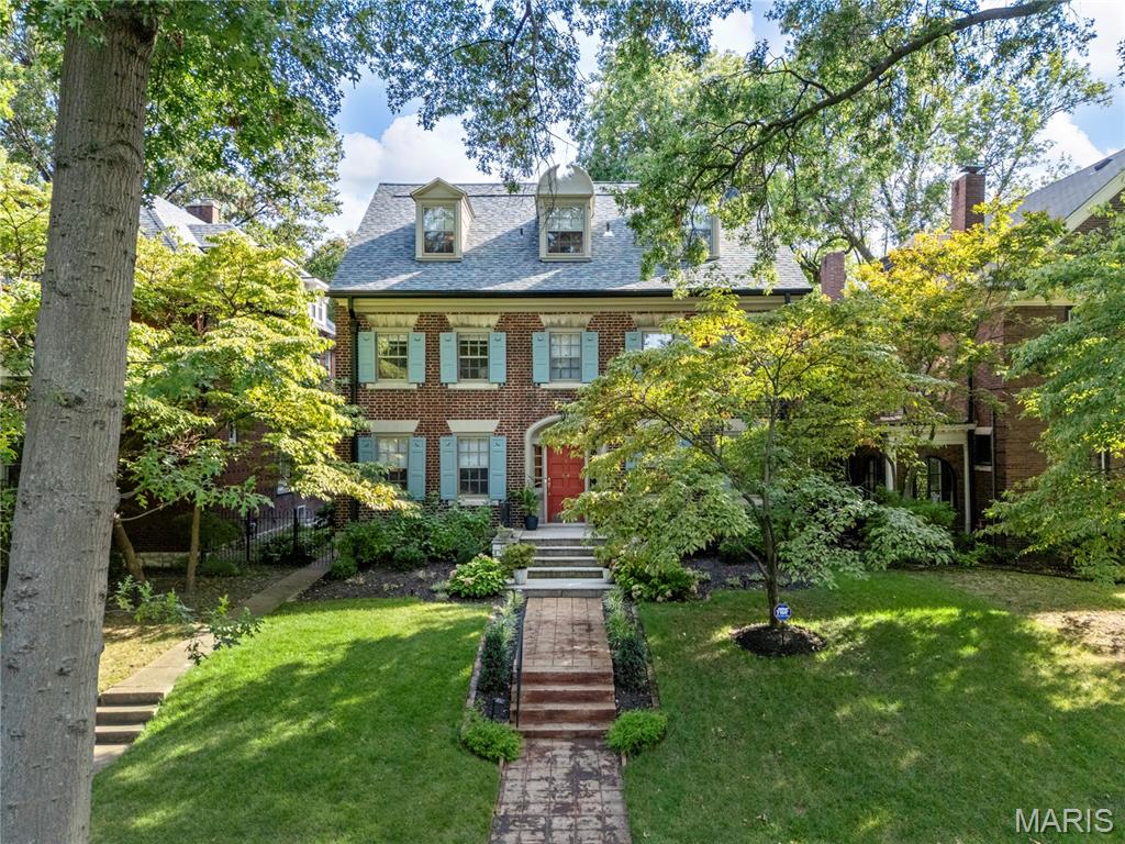 Experience the love and details poured into this one-year renovation where new and revitalized meets historic preservation in this 1917 5-bed, 3.5 bath Parkview gem blending century-old character with meticulous 2023 renovations. Behind its classic facade, every major system has been upgraded: new asphalt shingle roof, gutters, restored windows with storm protection, full exterior wood restoration, and lawn irrigation. Inside, new copper plumbing, dual 200-amp panels with all-copper wiring, upgraded HVAC with high-velocity attic system, and CAT6 wiring bring modern comfort and connectivity. Refinished white oak floors flow throughout light-filled rooms. The kitchen features new hardwood flooring, custom soft-close cabinetry, and professional-grade Jenn Air appliances. All four baths have been gutted and reimagined with designer tile, custom cabinetry, and premium fixtures. The master suite offers a two-head shower, water closet, and large walk-in closet; a Jack-and-Jill bath serves two additional bedrooms, each with new built-ins. Historic millwork, gracious room proportions, and period hardware honor the home’s past, while thoughtful updates provide turn-key living. Set on a 50’x189’ landscaped lot with formal gardens and a French courtyard fee just steps from quintessential St Louis dining, culture, parks, entertainment, Wash U, light rail and public transportation.