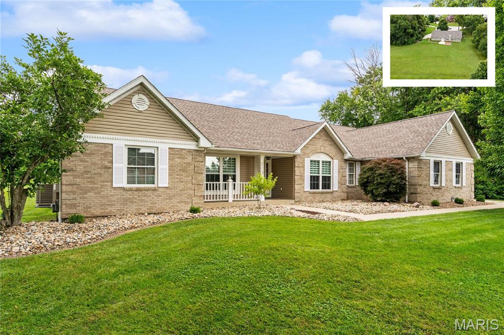 Welcome home to this beautifully maintained, move-in-ready 1-story residence located on a quiet cul-de-sac in the highly desirable Manors at Woodfield subdivision—just minutes from everyday conveniences: Target, Starbucks, Grocery Store, I-64, Downtown StL and Scott Air Force Base. This impressive split-primary floor plan offers 5 bedrooms, 3 full baths, and sits on over 1 acre of flat, usable land—perfect for outdoor living, family activities, gardening, and fully pool-ready potential. The extended patio features custom brickwork and a walkway that connects seamlessly to the side-load three-car garage and driveway. A wooded privacy buffer along the right side of the property enhances both seclusion and curb appeal.

As you enter, you’re welcomed by an extended foyer with soaring ceilings that lead into a spacious formal dining room with a tray ceiling and a bright living room featuring vaulted ceilings, a fireplace, and elegant glass French doors. The open-concept kitchen includes a prep island, abundant cabinetry, a pantry, and an eat-in breakfast area with direct access to the backyard—ideal for everyday living and entertaining. The primary suite is privately positioned and offers vaulted ceilings, a massive walk-in closet, and a luxurious en-suite bath with dual vanities, a soaking tub, a separate shower, and a private commode. The main level 2 guest bedrooms are generously sized with excellent closet space and share an oversized hall bath with a double vanity, ample linen storage and hall closets.

The finished full basement expands your living space with a large family room, 2 additional bedrooms, a full bath, and an impressive amount of unfinished storage. Recent updates include a new roof, new shutters, new siding, new hot water heater, new luxury wide-plank flooring, new baseboards, newer appliances, new basement family-room carpet, and updated kitchen faucets and toilets—ensuring a truly move-in-ready experience. With its spacious layout, modern updates, and exceptional lot, this Fulford built home offers outstanding value and the perfect blend of comfort, privacy, and convenience.