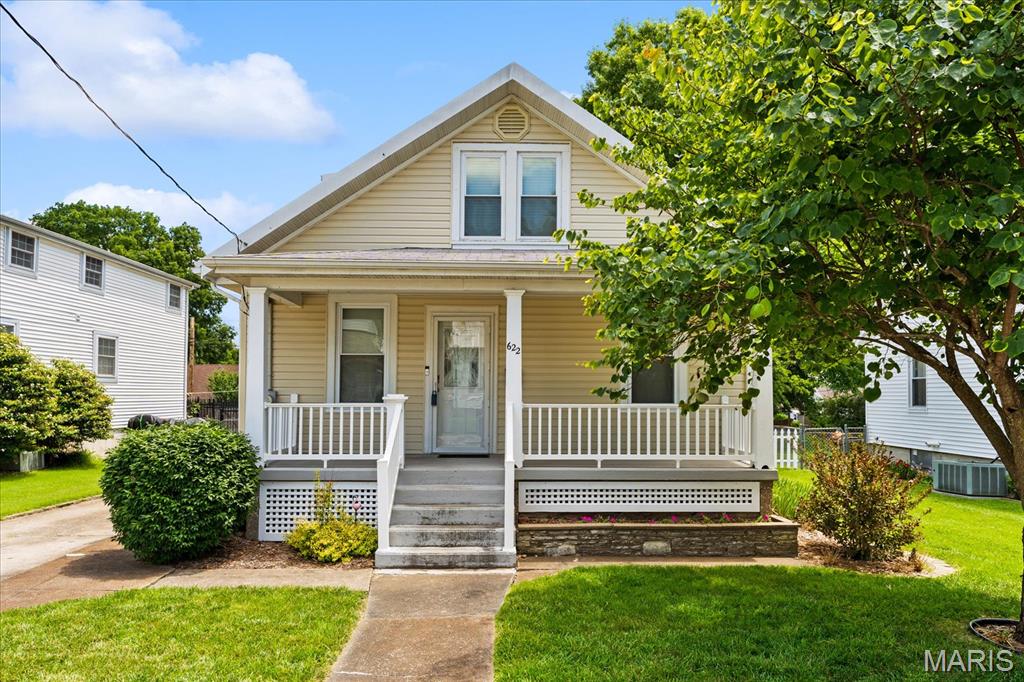 Nestled on a beautiful tree-lined street, this charming and well-maintained 3-bedroom, 2-bath home offers the perfect blend of character, comfort, and convenience. Enjoy relaxing mornings on the inviting covered front porch, or spend evenings entertaining on the backyard patio overlooking the fenced yard. The oversized detached one-car garage provides plenty of room for parking, storage, or a workshop. Inside, you'll find spacious rooms full of charm, including a primary bedroom with an impressive oversized walk-in closet. The home has been lovingly cared for and is move-in ready while still offering opportunities to make it your own. The basement is a blank slate, complete with a bathroom and a washer and dryer, providing endless possibilities for future finishing, storage, or hobby space. Located just minutes from Waterloo's local restaurants, shopping, and downtown amenities, this home offers small-town charm with everyday convenience. The durable tin roof adds to the home's character while providing lasting peace of mind. Don't miss your opportunity to own this inviting Waterloo gem!