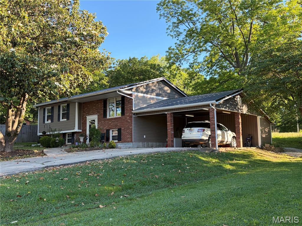 Discover a unique opportunity at 265 W Click AVE, Puxico MO 63960, a single-family residence with many recent updates including a new metal roof, guttering, siding/trim, windows, and remodeled interior with a fully finished basement.   Step out of the sunroom onto the recently constructed large treated wood deck with both covered and uncovered areas and a patio for gatherings, BBQ and more.  Conventiently located withing walking distance to the city park.  Numerous outdoor adventures await at nearby Wappappello Lake, Mingo Refuge, Duck Creek and more for fishing, hunting, hiking, boating, cycling, and more.  To truly appreciate the potential and charm of this residence, we invite you to schedule a private viewing.