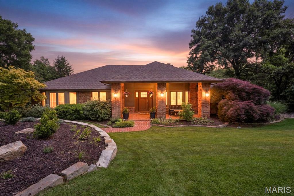 Your search is over! Nestled on 3 private acres, this exceptional property blends luxury, comfort, and functionality with an entertainer’s dream floor plan and resort-style outdoor living. From the fiberglass pool and cozy firepit to the theater room and expansive gathering spaces, every detail was designed for relaxing and entertaining. The flexible floor plan includes 4 bedrooms and 3 full baths with potential for up to 5 bedrooms. The refreshed chef’s kitchen features upgraded cabinetry, granite countertops, stainless steel appliances, tile backsplash, center island, and a beverage refrigerator and prep sink in the oversized breakfast bar making it ideal for hosting. The adjoining breakfast room is flooded with natural light from three walls of windows and opens seamlessly to the inviting great room with soaring cathedral ceilings and fireplace. Step down to the generously sized hearth room with wall of windows, soaring vaulted ceiling, and fireplace. The spacious dining room completes the space for exceptional everyday living and entertaining guests. The primary suite serves as a relaxing retreat with an updated luxury bath with new double sink vanity, a step-in shower, and two-person jet tub with serene wooded views. The hall bathroom on the main is also updated with a double adult-height vanity. The finished walk-out lower level offers exceptional versatility with a large recreation area featuring LVP flooring and large bar serving area, a fourth bedroom with fireplace, theater room, full bath, an office or additional sleeping area, and a mud room off the tuck-under garage. Outdoor living is equally impressive with a screened porch, patio, covered front porch, pool, fire pit area, and peaceful wooded surroundings creating the perfect private oasis. Exceptional features include beautiful wood flooring, main floor laundry, oversized 3-car tuck-under garage with workspace, and energy-efficient 14+ SEER zoned cooling system. Impeccably maintained and thoughtfully updated throughout—this is a rare opportunity to enjoy privacy, space, and exceptional entertaining both inside and out. Buy with confidence and receive the Assurant Home warranty for one year.
