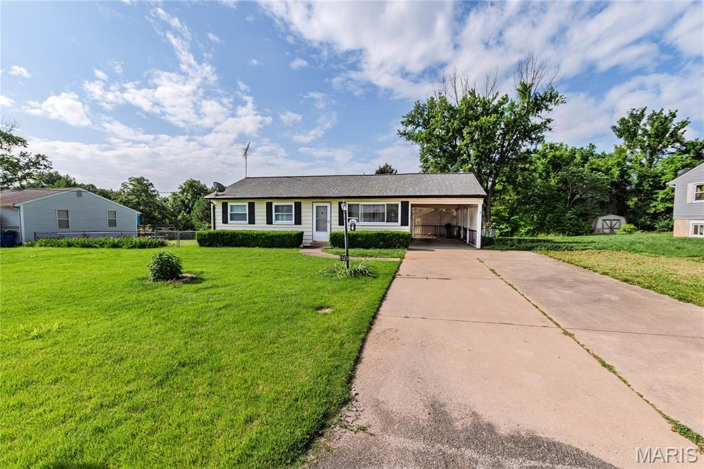 Solid 3 bedroom home with covered parking and a large lot with a great view of neighbors pond. Enter into 16x11-1/2' front living room that opens to a good size eat-in kitchen that has lots of cabinets, dishwasher, gas stove, and double sink. Down the hall are the three bedrooms with one full bath. Mostly original hardwood floors throughout the home are in good condition. Nice curb appeal, low maintenance exterior, supersize carport, enormous rear fenced yard, good size shed on a quiet street. Has insulated vinyl windows, 100 amp electrical service with breakers, and an unfinished basement offering additional opportunities. Roof believed to be around 10 years old. Great opportunity for someone looking to own a house for less than most rentals these days and make it their own home. Great location close to MasterCard complex. Come see starting Friday!