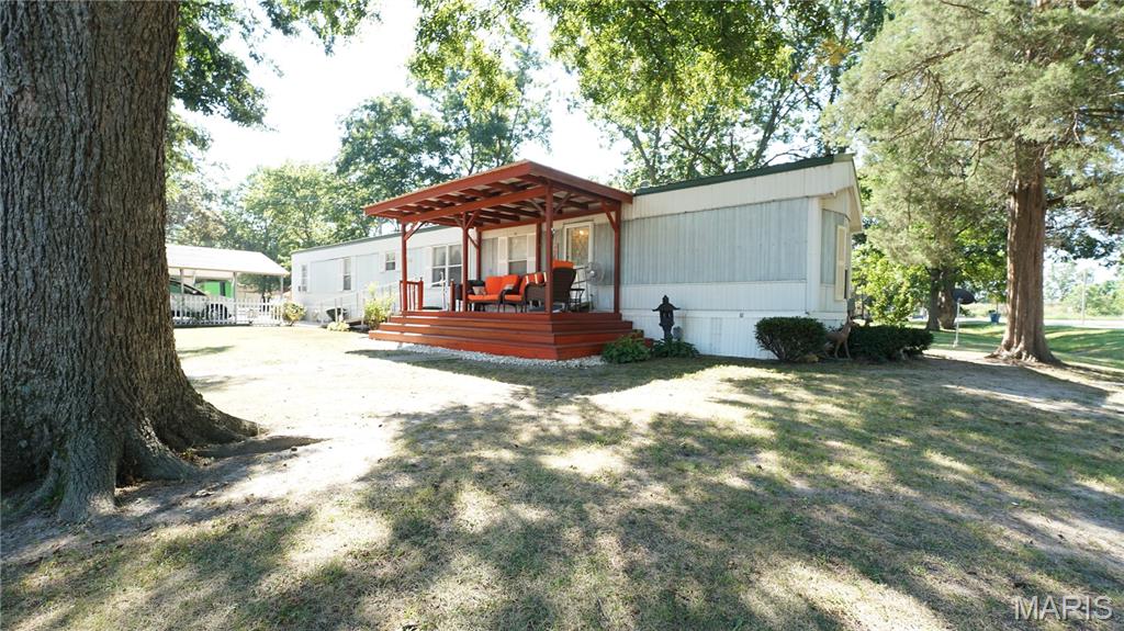 Don't miss this well-maintained 2-bedroom, 2-bath mobile home offering 1,216 square feet of comfortable living space on two lots totaling approximately 0.53 acres in Fisk, Missouri. 

Built in 1994, this home features a functional floor plan with several recent updates, including all new flooring installed in 2025. The kitchen and both bathrooms feature durable, waterproof luxury vinyl plank flooring, and the updated water heater adds additional peace of mind. All appliances are included, making this home truly move-in ready.

Outside, you'll find plenty of room for vehicles, hobbies, and storage. The detached carport provides covered parking, while the 30x40 shop building, built in 2000, offers endless possibilities for a workshop, storage, or projects. Two additional storage buildings provide even more space for lawn equipment, tools, and seasonal items.

Situated on two corner lots totaling approximately 0.53 acres, this property provides plenty of outdoor space to enjoy while offering the convenience of small-town living. Whether you're looking for your first home, a place to downsize, or an investment opportunity, this property delivers exceptional value with its spacious lot, multiple outbuildings, and thoughtful updates.

Schedule your private showing today and come see all this Fisk property has to offer!
