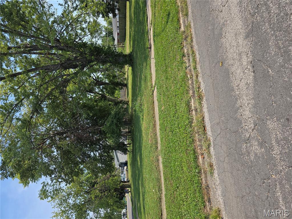 Great corner, buildable lot slightly over a third of an acre.  Previously, a mobile home was on this lot with all utilities.  Seller does know that utilities are all available at the street, but are unsure if the sewer and water are still up to the area where the mobile home was located.  Bring your ideas and lets grow!