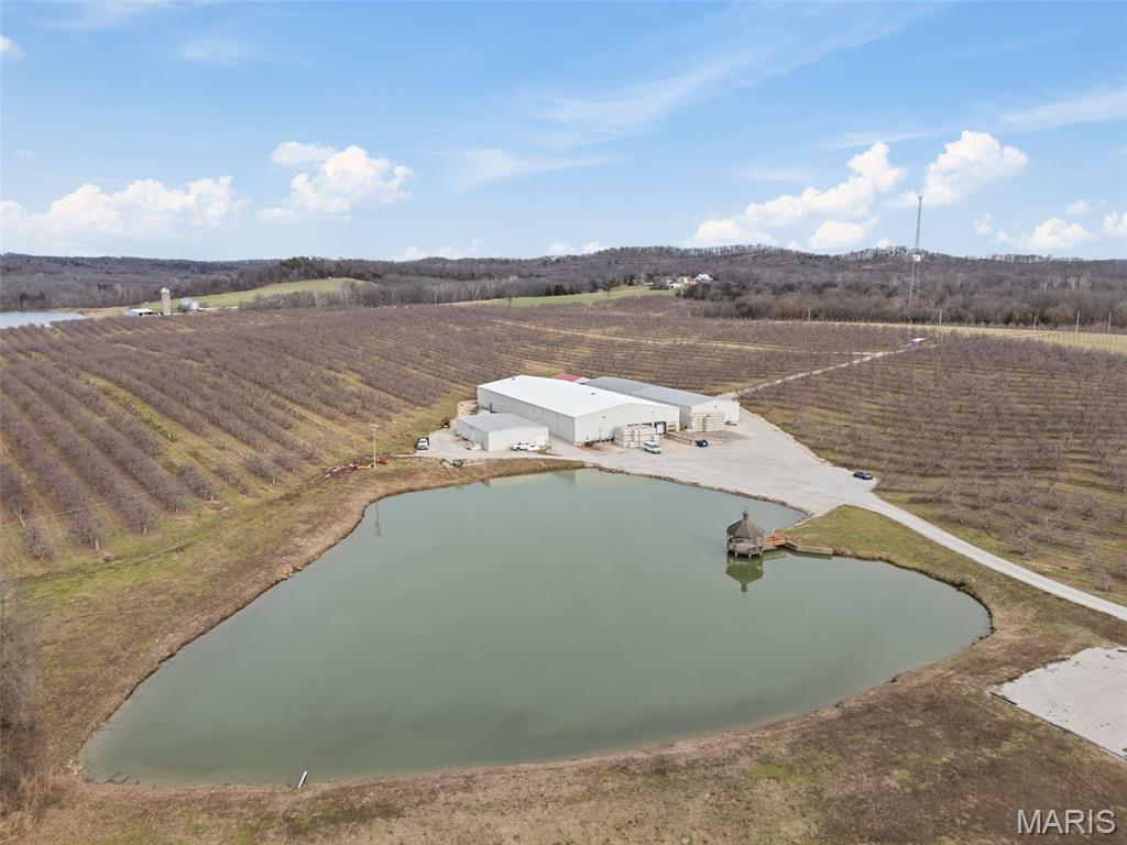 The Renowned Donnelan Apple Farms
Bailey Properties, Inc. is honored to present a rare and prestigious opportunity to acquire Donnelan Apple Farms, a cornerstone of Missouri’s agricultural landscape. Located just outside Washington in Marthasville, MO, this offering represents the perfect marriage of a storied family legacy and a high-output commercial enterprise.

The Orchard & Acreage
Spanning a total of 228+/- acres, this operation features 160+/- acres of high-yield producing apple orchards. The farm is strategically distributed across three separate sites, all located within a convenient five-minute radius of the central production hub. This geographical layout ensures operational efficiency while providing a diverse landscape for cultivation.

World-Class Infrastructure
The heartbeat of the operation is the 106+/- acre main site, home to an impeccably maintained 36,000+/- SQ FT industrial warehouse. This first-class facility is fully equipped to handle every stage of the supply chain:

Climate-Controlled Cold Storage: To maintain peak fruit freshness.

Commercial Packing House: Streamlined for high-volume distribution.

Cider Production Suite: Dedicated area for value-added product creation.

Expansive Storage: Ample space for equipment and seasonal inventory.

While currently optimized for apple production, the "first-class" condition and massive footprint of this building offer incredible versatility for alternative industrial or agricultural uses.

A Turn-Key Investment
It is rare to find a business that has been meticulously family-owned and operated for decades. Donnelan Apple Farms is not just land; it is a proven brand with established systems and premium infrastructure. Whether you are an agricultural investor looking to expand your portfolio or an entrepreneur seeking a diversified business venture, this property offers limitless potential for growth and innovation.