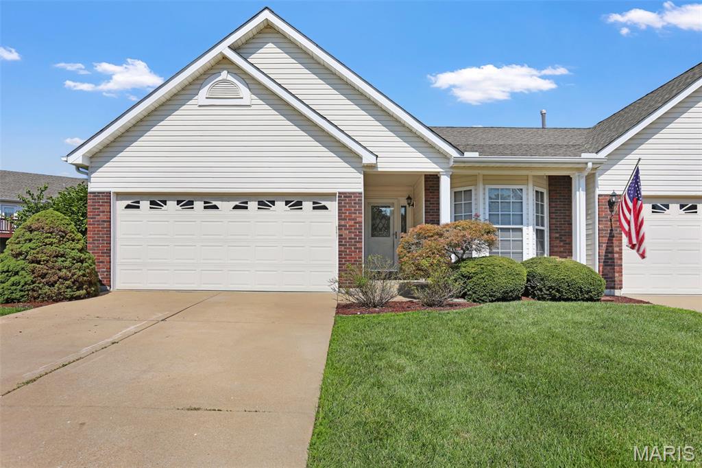 Affordable Villa & Comfortable Living All on One Level!  2 Car Attached Garage with Concrete Driveway.  End Unit.  Brick with Vinyl Siding. Decorative Front Door.  Patio.  Entry Foyer with Wood Flooring flows into Hallway. Vaulted Great Room with Gas Fireplace. Large Kitchen with Bright Breakfast Room w/ Bay Window, Double Sink, Gas Stove, Dishwasher, Microwave, Backsplash and Pantry.  MAIN FLOOR LAUNDRY. 2 Bedrooms including Primary Suite with Full Bath and Walk in Closet. 2 Full Baths.  Open Staircase to Lower Level with Plenty of Room for Storage and a Rough in Bath.  Walk out from Great Room to Nice Patio and Green Space.  No need to Mow the Lawn!  Great Location.
