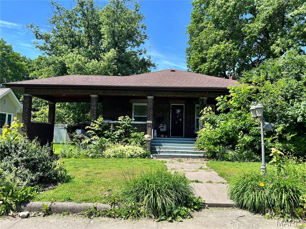 Charming 1-bedroom, 1-bath home with the potential to be converted back into a 2-bedroom layout. Features include hardwood floors, original woodwork, built-in cabinetry, stained glass windows, and a fireplace that adds character to the living space. The kitchen offers access to a small rear porch, while the full basement provides ample storage. Additional storage available in the backyard shed. Property is being sold as-is, including all contents currently in the home. Cash or conventional financing only. Seller will make no repairs under any circumstances.