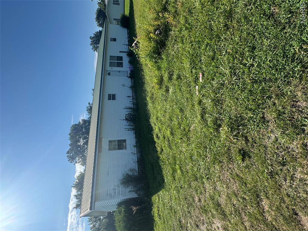 Manufactured home located on large corner lot. Home has 3 bedrooms and 2 baths. Two car carport in back with attached shop.  Large deck with attached ramp. Storage shed. Home is sold as is. Call today for your showing.