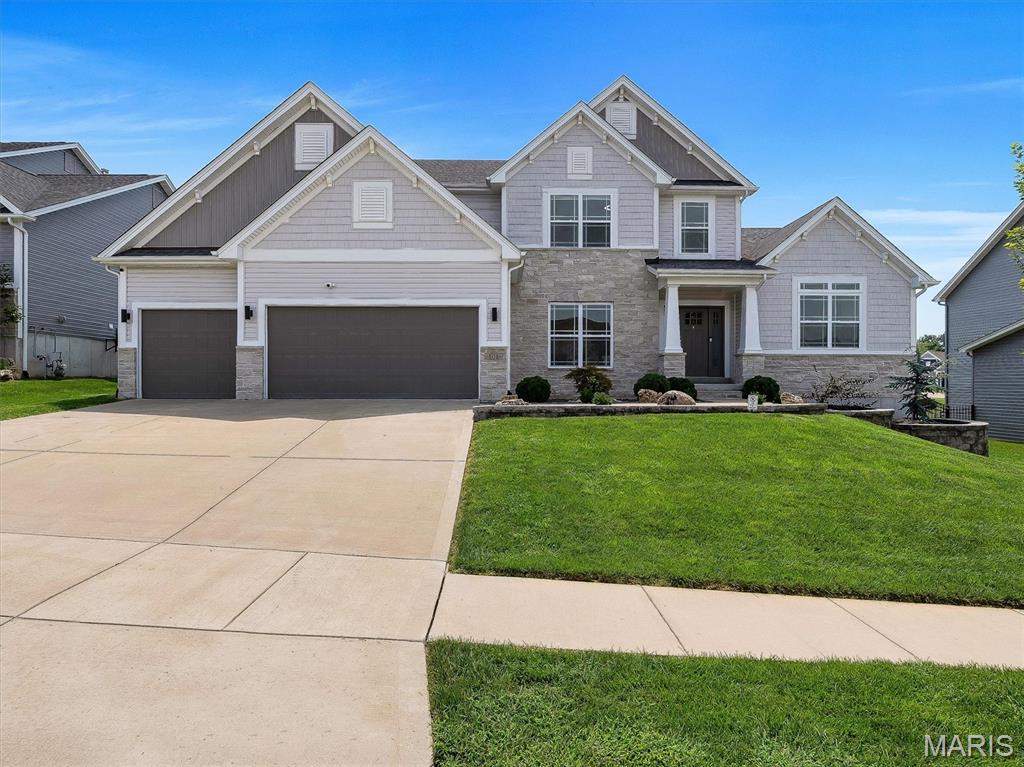 NEW PRICE! Exceptional Value—Everything is already done. If space, style, and total flexibility are at the top of your list, 502 Leaning Woods delivers. Located in the highly desirable Villages of Sandfort Farms, this beautifully maintained, five-year-young custom home offers more than 5,100 finished square feet of pristine living space across three thoughtfully designed levels. Sellers are ready to make a move, presenting an incredible opportunity for a buyer looking to walk right into a move-in ready luxury property. Main Level & Luxury Chef's Kitchen. The heart of the home features a standout chef’s kitchen equipped with an oversized island, custom cabinetry, premium finishes, and expansive prep space. It flows seamlessly into a bright dining area and a hearth-style sitting room, where a striking two-sided fireplace connects beautifully to the main living room—perfect for hosting or quiet evenings. Escape to the primary suite, complete with elegant tray ceilings, three separate closets, and a spacious, spa-like ensuite featuring dual vanities, a large walk-in shower, and a deep soaking tub with 14' vaulted ceilings. Upstairs, you will find three additional oversized bedrooms, two full baths, and a massive bonus/game room that offers the ideal footprint for a home movie theater, hobby space, or playroom. Flexible Lower Level & Entertainment Hub with a fully finished lower level adds incredible versatility to the estate. It features an impressive wet bar with granite countertops, a large secondary living area, a private office, a fifth bedroom, and a ¾ bath. You'll also find an unfinished gym space that can easily be transformed into a dedicated home theater or private yoga studio, alongside massive storage capacity. Premium Outdoor Living & Community Amenities. Step outside to enjoy your own private oasis, featuring a 16x33 maintenance-free Trex deck, a professional landscaped yard, designer exterior accent lighting, and a newer 24-foot concrete patio. A spacious 3-car garage, full sprinkler system, neighborhood pool, and community park complete this exceptional package. With newer construction, extensive finished square footage, flexible multi-use rooms, and upgraded indoor/outdoor living spaces, 502 Leaning Woods offers the turnkey lifestyle today’s buyers are searching for. Schedule your tour today!
