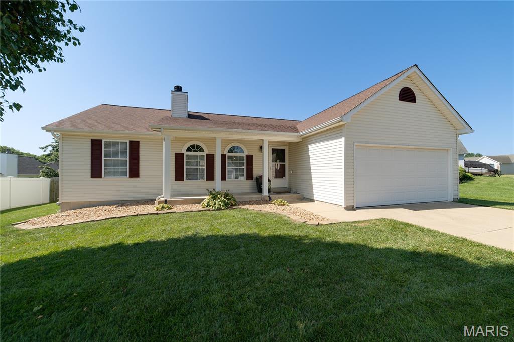 THIS IS THE ONE! Beautifully updated 3-bedroom, 3-bath ranch featuring an open floor plan, finished lower level, main-floor laundry, and oversized 2-car garage. Step inside to soaring vaulted ceilings, gleaming floors, and a spacious great room with a cozy wood-burning fireplace. The kitchen offers abundant cabinetry, stainless steel appliances, a gas stove, and opens to the breakfast room with wainscoting and French doors leading to the patio—perfect for entertaining. The primary suite features a walk-in closet and an updated spa-like ensuite. Two additional bedrooms and a full bath are located on the opposite side of the home for added privacy. The main-floor laundry includes extra cabinetry and garage access. The finished lower level is an entertainer's dream with a large recreation room, custom bar with island seating, home office, workout area, and a third full bath. Outside, enjoy the spacious patio for relaxing or hosting family and friends. Move-in ready with the perfect blend of style, comfort, and functionality. Showings begin Thursday, July 16th!