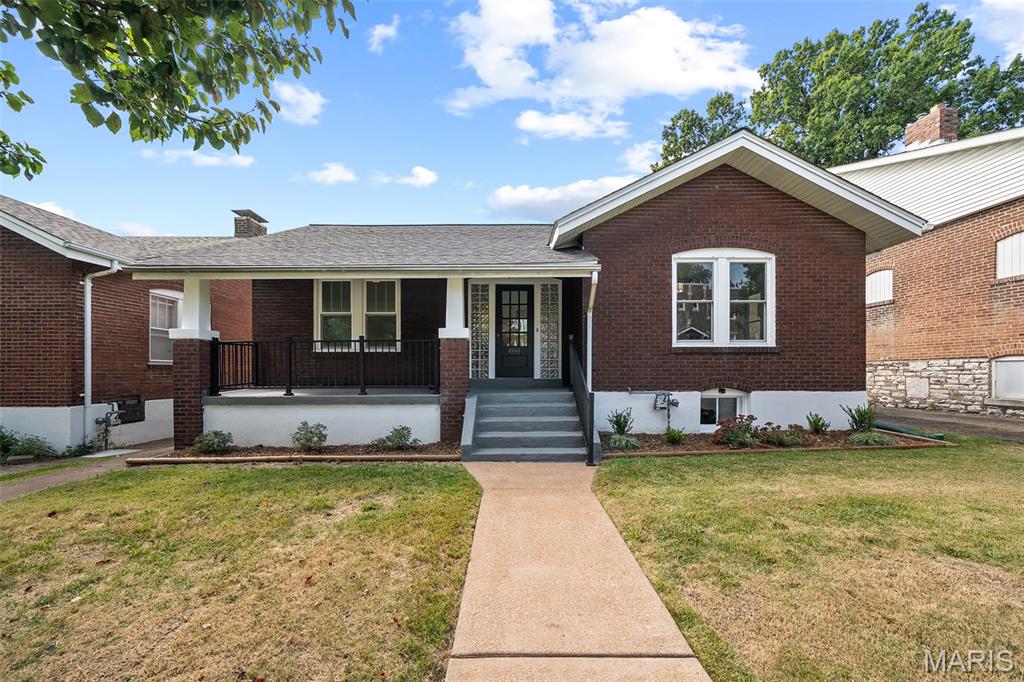 Welcome to the timeless charm of this beautifully updated 1922 brick home, where classic architectural character meets modern comfort. From the moment you arrive, the inviting oversized front porch and handsome brick exterior set the tone for a home filled with warmth, natural light, and enduring appeal. Inside, the main level features beautiful hardwood floors and an array of original details. The spacious living room is rich with character, showcasing a classic coffered ceiling, detailed crown molding, and oversized windows that fill the space with abundant natural light. The light-filled kitchen thoughtfully blends vintage charm with contemporary updates. Warm wood cabinetry is complemented by sleek quartz countertops, stainless steel appliances, and a classic tile backsplash. A striking brick accent wall with open wood shelving adds texture and character, creating a space that is both stylish and inviting. Through a beautiful arched doorway, the sun-drenched dining room offers built-in bench seating, providing the perfect setting for casual meals or entertaining guests. The home offers three comfortable bedrooms and two full baths, with a finished lower level providing additional flexibility for a family room, office, or recreational space.  The lower level full bath and convenient laundry area add to the functionality of this space. Outside, enjoy a spacious backyard with plenty of room for relaxing, gardening, dining al-fresco, or hosting family and friends. A one-car garage provides convenient parking and additional storage. Full of character and thoughtfully updated for modern living, this delightful brick home offers the best of both worlds--historic charm and contemporary comfort. Ideally situated in beautiful Princeton Heights, you'll enjoy easy access to a wonderful selection of restaurants, shopping, and neighborhood amenities. Move in and enjoy!