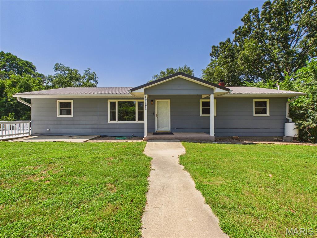 Welcome to your private oasis located In Marble Hill! This beautiful property features 4 bedrooms and 1 full bathroom, located right outside of city limits it perfectly blends a peaceful setting with comfortable living. The Sellers have poured extensive work into this home making it completely move in ready for its next owner!! The spacious layout offers plenty of space with 3 generous sized bedrooms and the 4th bedroom offering walk out access to a deck perfect for relaxing!!  The home does offer main level laundry as well. The basement has been completely finished since the owners have purchased the home featuring walkout access also including vinyl plank flooring throughout as well as Wood-Burning stove perfect for those cozy winter days or a second source for heating! As you step outside your greeted by a brand new 24x35x10 shop with an 8ft lean to! The shop is equipped with electric as well as concrete floors!! The owners underwent a massive tree clearing project, that has opened up beautiful useable yard space while also bringing in over 200 tons of gravel for the driveway that leads back to the shop/ cleared area. All of this is situated on 3.11 private acres!!! The property is completely fenced in and also offer trails throughout the wooded areas perfect for riding and relaxing. HUGE BONUS -never worry about losing power again; this property features a full in-home Generac generator System to keep everything running seamlessly through any weather!!! This system is less than 3 years old and hardly has any hours on it!!! The updates this property has undergone is something you need to see for yourself!! Don't miss out on the opportunity to own your own private oasis.