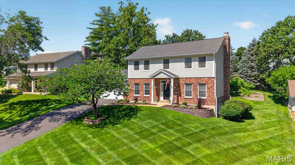 Pride of ownership is evident throughout this beautifully maintained and thoughtfully updated 4-bedroom, 2-story home tucked away on a quiet cul-de-sac in the sought-after Claymont subdivision. Located within the coveted Claymont Elementary attendance area and award-winning Parkway School District, this home offers the space, setting, and location that make it easy to enjoy for years to come. A classic center hall floor plan provides timeless appeal, while the main living areas flow effortlessly from one room to the next. The kitchen opens seamlessly to the family room, creating an inviting layout for busy weekdays, family dinners, and effortless entertaining. The spacious main floor laundry room is filled with natural light and features the included washer and dryer along with a custom waterfall countertop that serves as a convenient folding station and everyday drop zone adjacent to the garage. Upstairs, the spacious primary suite offers a peaceful retreat with an updated bath featuring a frameless glass shower. Three additional bedrooms share an updated hall bath, providing plenty of room for guests, hobbies, a playroom, or work-from-home flexibility. Step outside and enjoy a backyard designed for both relaxation and play. The expansive composite deck with built-in gas fire pit extends your living space outdoors, while the soothing stacked granite water feature creates a relaxing backdrop for morning coffee or evening gatherings. Professionally terraced landscape beds maximize the usable lawn area, creating ample space for outdoor activities and recreation. Thoughtfully designed landscape lighting highlights the home's exterior and outdoor living spaces after sunset, while the in-ground sprinkler system helps keep the lawn and landscaping lush and beautiful with ease. The unfinished lower level offers abundant storage and endless possibilities for future expansion, and the garage features extensive built-in storage to keep bikes, sports equipment, and seasonal items neatly organized. Combining a coveted cul-de-sac location, exceptional schools, inviting outdoor living spaces, and a desirable four-bedroom floor plan, this is a home designed for making memories for years to come.