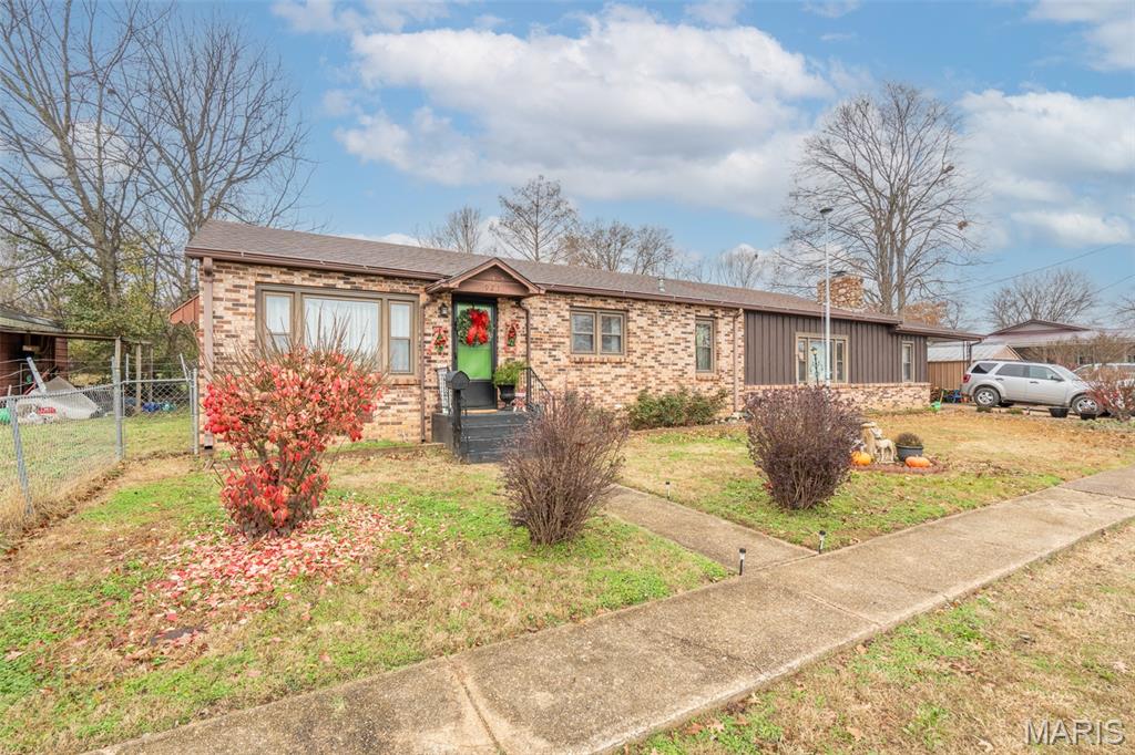 Step into comfort and convenience in this spacious 4-bed, 3-bath brick home on a large fenced lot right in town. This well-kept property offers multiple outbuildings for storage, hobbies, or workspace, and puts you close to schools, shopping, dining, and everything you need.