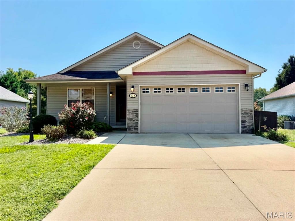 Beautifully maintained and move-in ready 3 bedroom 2 bathroom home situated on a cul-de-sac with lovely landscaping and great curb appeal.  The spacious living room features a cozy fireplace, while the dining room offers access to a deck overlooking the privacy-fenced backyard perfect for relaxing or entertaining.  Enjoy the convenience of a two-car attached garage and covered front porch.  The full unfinished basement provides an abundance of additional space and endless possibilities for the new owner to create exactly what they envision, whether it's a family room, home office, recreation are or additional living space.  A wonderful home with room to make it uniquely your own.