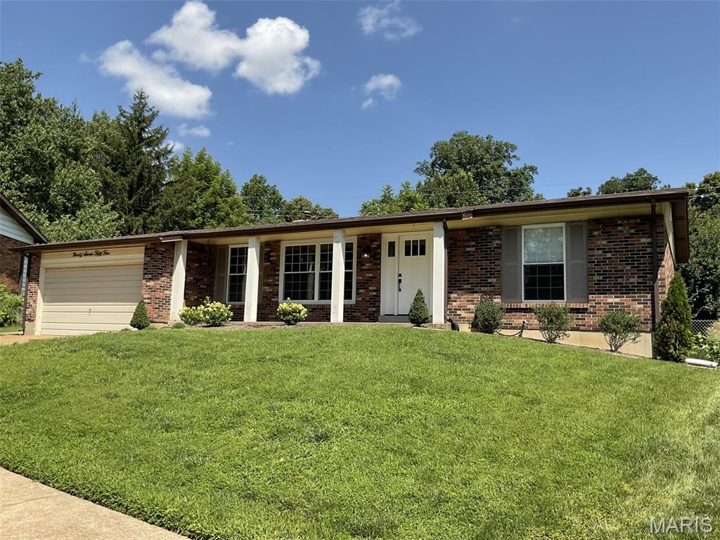 THIS IS IT! Located in the Lindbergh School District, directly across Gravois from Grant's Farm and a couple of minutes from Grant's Trail this attractive, comfortable, 3 Bd, 2 Ba, 2-car garage home with a fenced yard may be just what you have been looking for. The entire main floor has been professionally painted and professionally cleaned. The living/dining room has newer luxury vinyl plank flooring and the updated kitchen and baths have ceramic tile flooring. There is wood flooring and a wood-burning fireplace in the family room. The stainless appliances in the updated kitchen are all newer and will remain in the home. The washer and dryer on the lower level will also stay. The unfinished lower level is conveniently equipped with built-in storage shelves but leaves a huge area for you to turn into your dream space. Sellers are offering a home warranty to help you move comfortably into your new home. The mini fridge in the lower level will be removed before closing. Contact your agent and come take a look!