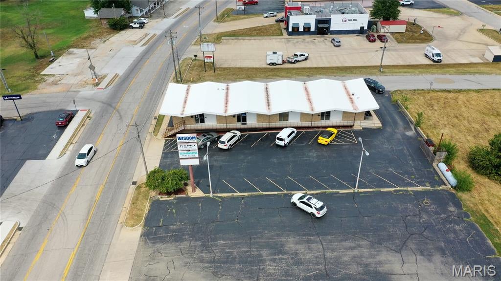 Prime Commercial Rental Opportunity in Salem, MO! Located at 800 S. Main Street, this exceptional commercial property offers 5 rental units and 5,512 square feet of finished space in a highly visible, convenient location. The building currently houses a beauty salon, financial advisor office, real estate office, and radio station in the lower level, offering a diverse mix of established commercial tenants and income potential. Meticulously maintained by the same family since 1965, this attractive all-brick building combines a classic exterior with modern interior updates and professional office spaces. A brand-new EPDM roof was installed in 2026, adding even more value and peace of mind for the next owner. Situated on Main Street in the heart of Salem, the property benefits from excellent visibility and high traffic, just off a state-maintained highway. The asphalt driveway and parking area provide convenient access and ample parking for tenants, customers, and employees. Whether you are looking to expand your investment portfolio or secure a versatile commercial property in a prime downtown location, this property offers outstanding possibilities. Schedule your showing today!