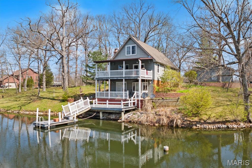 Secluded Lakefront Retreat on Lake Catatoga! Experience tranquil lakeside living with over 250 feet of shoreline on a 66-acre private lake. This Beautiful 4-bedroom, 3-bath home offers 2,100+ sq. ft. of beautifully designed space, including a updated kitchen and dining area that opens to a large deck with sweeping lake views. The lower level features a cozy family room, a master suite with bath, and a walkout to a patio, deck, and dock—perfect for relaxing or entertaining by the water. The oversized 2-car garage provides ample storage, while a concrete driveway and 16 KW propane emergency generator add convenience. Enjoy two levels of covered decks, making this the ultimate lakeside sanctuary. With .7acres across two parcels, this rare gem promises the perfect blend of privacy, comfort, and natural beauty. Don’t miss out on your waterfront dream home!