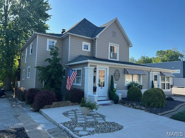 Beautiful two-story home just one block from historic downtown Vandalia. This home offers numerous possibilities. Main level has a private entrance office. Stepping into the enclosed front porch of the private residence leads to the foyer with open staircase. French doors into the living room with an antique fireplace. Large dining room and the original kitchen with a farmhouse sink. Main level bedroom with en-suite bath and laundry. Upstairs you'll find separate living quarters that feature a living room, dining room, kitchen, bedroom with walk-in closet and full bath. French doors from the dining room lead to a treetop multi-level deck and down the steps to a well landscaped lawn. Two outbuildings with garage doors, ample parking for office and guest alley access. AGENT OWNED