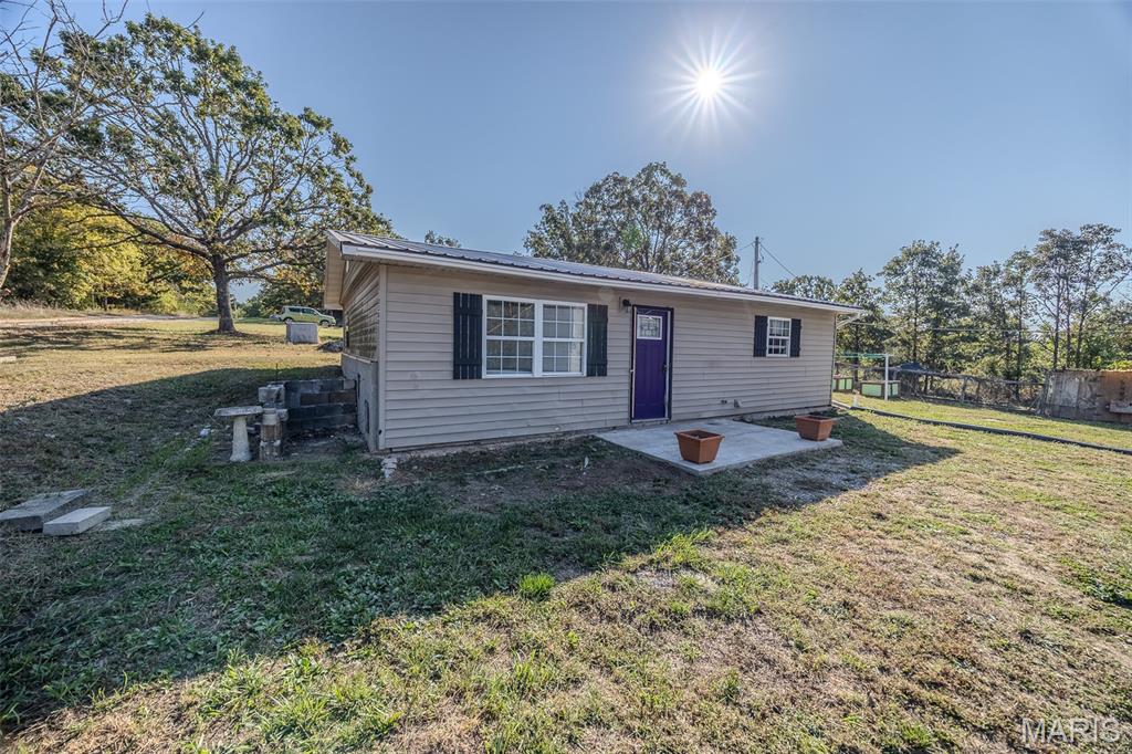 Tucked away on a peaceful dead-end road, this unique 2-bedroom, 1-bath earth berm home offers the perfect blend of privacy and convenience, just minutes from town. Designed for comfort and energy efficiency, the home features an open-concept main living area filled with natural light and rustic charm. Step outside and enjoy a productive landscape: two apple trees lovingly planted by the current owners, grapevines growing alongside the home, strawberries thriving in two and a half charming barrels near the raised garden beds, and wild raspberries growing on the property. It’s a property that invites you to garden, harvest, and truly enjoy the outdoors. The detached shop adds even more value, offering endless possibilities for a workshop, hobby space, or extra storage. With a little vision, this special property is brimming with potential.