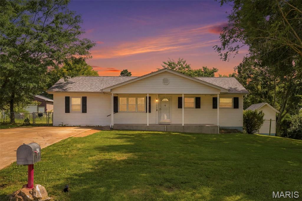 Welcome to this charming 3-bedroom, 1-bath ranch offering 1,176 square feet of comfortable living space on a spacious .67-acre corner lot! Inside, you’ll find a bright living room, an eat-in kitchen with abundant cabinetry and included appliances, plus a cozy family room featuring a fireplace and access to the large back deck. Hardwood flooring adds warmth to the bedrooms, while the full, unfinished basement with an 8-plus-foot pour offers generous storage and potential for future finishing. Outside, enjoy mature trees, a partially fenced area, plenty of room to garden or entertain, and two included storage sheds. Per the seller, horses are permitted, and one shed was previously used as a horse stall. Additional highlights include a covered front porch, off-street parking, a 10/24 HVAC system, a 2023 water heater, a 5/25 roof, and select newer siding. Located approximately five minutes from High Ridge shopping, dining, and everyday conveniences. Schedule your showing today!
