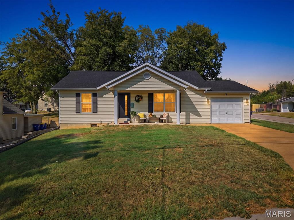 **LOCATION, LOCATION, LOCATION!** Welcome to this charming and exceptionally well-maintained ranch home in the heart of Festus! Located just a 2-minute walk from Festus Main Street, you'll have shops, restaurants, entertainment, and so much more right at your doorstep.

Inside, you'll find a clean and inviting open floor plan featuring beautiful wood flooring throughout most of the home, creating a warm and cohesive feel. The spacious kitchen offers plenty of cabinet storage and room to prepare and enjoy meals. **All appliances stay with the home**, making this move-in-ready property even more convenient. The updated bathroom adds a fresh touch, while two comfortable bedrooms provide the perfect amount of space.

Step outside and enjoy the adorable front porch—perfect for your morning coffee or relaxing in the evening. The flat backyard offers plenty of possibilities for outdoor enjoyment, gardening, or entertaining. A one-car attached garage provides convenient parking and additional storage.

Whether you're looking for your first home, a low-maintenance place to downsize, or a convenient home to enjoy in retirement, this one checks all the boxes. Don't miss the opportunity to own a well-cared-for home within walking distance of everything downtown Festus has to offer!