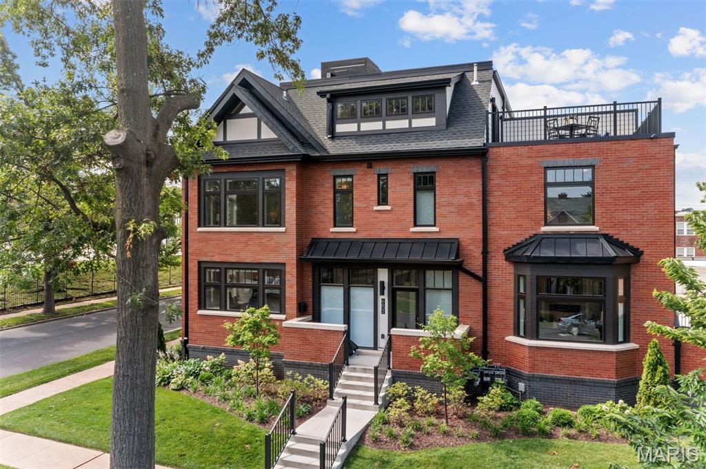 Welcome home to modern living in the heart of Clayton w/ this impeccable 2 year-old townhouse located in the HiPointe-Demun neighborhood. Combining style, convenience, comfort & stunning multi-level outdoor living space, this 3-story home offers the perfect blend of urban living w/ suburban charm. Step inside to discover a bright, open-concept layout featuring high ceilings & contemporary finishes. A fireplace & built-in bookshelves serve as a focal point to the spacious living & dining rooms, which flow seamlessly into a sleek, designer kitchen complete w/ a center island, Vadara quartz countertops, subway tile backsplash, stainless steel appliances, hot water dispenser & a walk-in pantry—ideal for entertaining or casual meals. The 2nd floor boasts a serene primary suite w/ a luxurious bathroom- double vanity, shower, built-in dresser & walk-in closet along w/ an ensuite bedroom w/ custom closets & laundry room w/ ample storage. The open & airy loft-like 3rd floor offers an addt'l bedroom, bathroom & French doors lead to the top level of private outdoor space—perfect for relaxing or enjoying your morning coffee. A spacious lower level & garage ideal for storage, work or hobbies. Located within walking distance to top-rated schools, shopping, restaurants, parks & transit, this property provides unmatched convenience in one of Clayton’s most desirable communities.