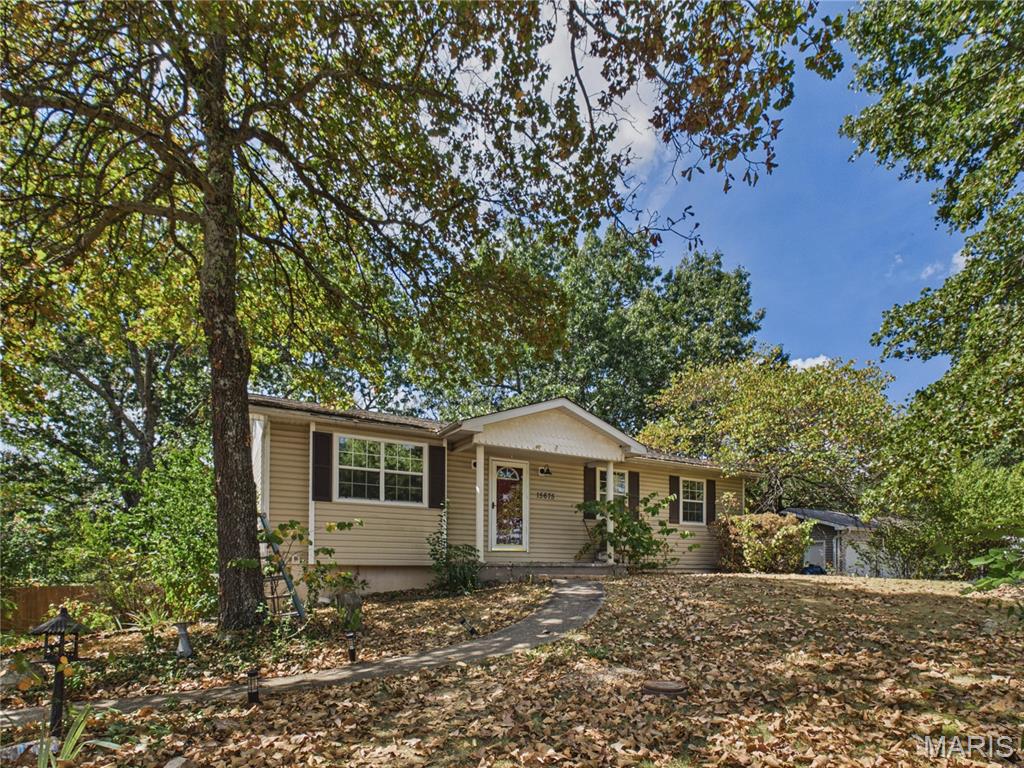 This property on Talon Lane is a perfect fit for those looking to check all the blocks in the Fort Leonard Wood area. Only three miles/ 8 minutes from the main gate of Fort Leonard Wood and easy access to: the surrounding retail shops, restaurants, amenities and highway. Upon approach, you'll feel at ease as the lot is filled with mature trees offering both ample shade and privacy. Pulling into the driveway, there is an oversized carport with a walkway leading either up to the main entrance or a few steps down to the walkout basement and garage/ workshop. The main floor features 3 beds and 2 baths at roughly 1200 sq ft. It walks out to a covered back porch off the kitchen/ dining and leads down to a fenced backyard with a shed and a half court basketball area! The downstairs has unique newly remodeled living area non-conforming bedroom and a full bathroom; ready for a variety of uses! Showings available starting Labor Day weekend!