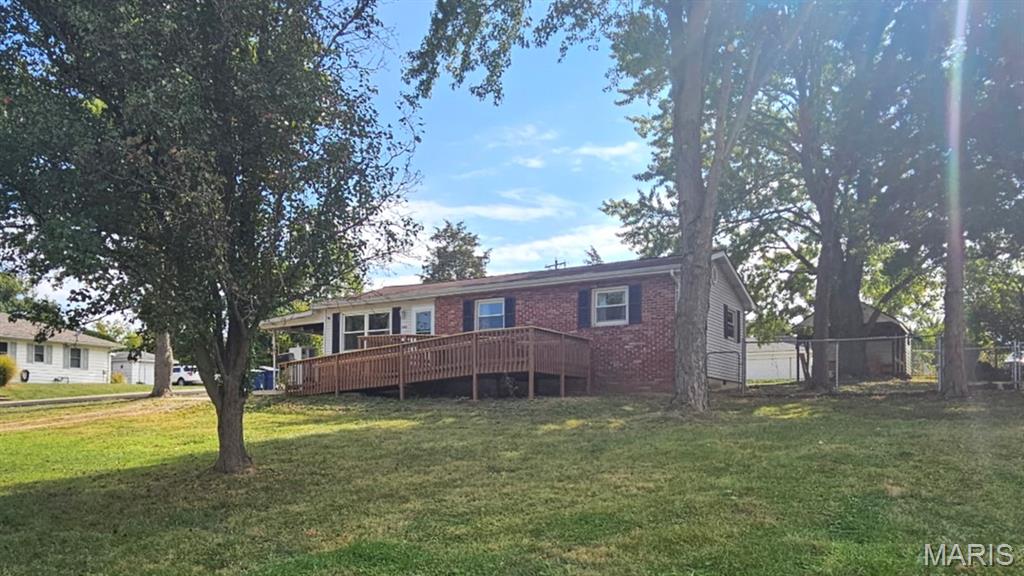 Investor opportunity -This 3-bedroom 1-bath home is full of charm. Set on a nice-sized lot, the home offers privacy from neighbors, though tucked on a quiet, off-the-path neighborhood street. This home features easy maintenance engineered flooring throughout. The backyard is a standout -nice size flat fenced yard with a covered pavilion perfect for outdoor gatherings, weekend barbecues, or a dedicated hobby or project space. Parking is generous, with a covered carport and an extra closed private storage area. Located in a desirable neighborhood just minutes to all key amenities, shops, and services. Seller prefers an As IS Sale.  Tenant occupied by lease until Oct. 2026