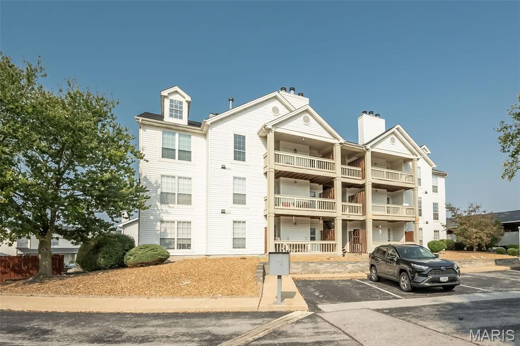 Don’t miss this bright and inviting 2 bed / 2 bath condo in the sought-after Springhill Farms community in Ballwin. Filled with natural light and modern accents throughout, this move-in-ready 1,020 sq. ft. home features a spacious primary suite with walk-in closet, an updated kitchen with granite countertops and stainless steel appliances, stylish wainscoting in the dining area, private in-unit laundry, and a cozy living room with a fireplace and balcony access. Enjoy peaceful community living with a covered carport space, pool, clubhouse, and an unbeatable location close to shopping, dining, and more.