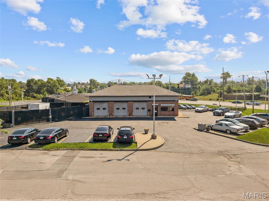14150 Sunswept Park Court is a 1,870 SF single-tenant automotive shop situated on 0.90 acres in Florissant's most active retail corridor. Built in 1985 and maintained in good condition, the building features three drive-through service bays facing the street, each equipped with hydraulic lifts and a full complement of shop equipment, delivering a genuinely turn-key configuration for any automotive operator. HVAC is present throughout the shop space. The property includes 20 surface parking stalls on a recently re-sealed and re-striped lot, with the roof and tuck-pointing addressed on an ongoing basis. The building sits on a signalized intersection with 19,481 vehicles per day passing the site, and is zoned B-3 (Extensive Business District), accommodating a wide range of commercial uses.

The 0.90-acre footprint carries equal, if not greater value as a redevelopment site. B-3 zoning, a signalized corner position right across the street from Walmart, and direct frontage on this corridor make the land ideally suited for a QSR franchise pad, drive-through retail concept, or virtually any format retailer seeking visibility; in a trade area anchored by over a dozen national brands directly across the street and within immediate walking distance.