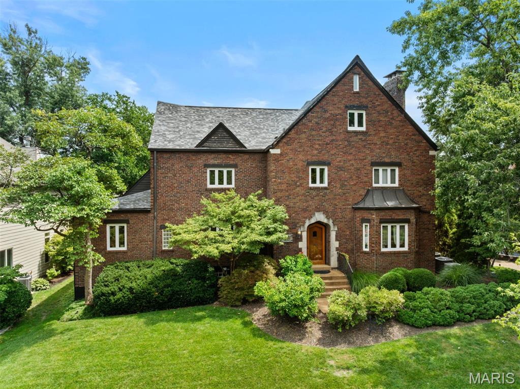 Built in 1929, this home has the charm of an architectural masterpiece with the warmth, personality and major updates of 21st century living. Leave your car in the spacious garage and enjoy a short stroll to all that downtown Clayton has to offer. With a new roof, 3 of 4 air conditioners and 2 of 4 furnaces less than 2 years old and updated interior finishes, this gracious home is ready for its next chapter. Upon entering into the impressive foyer, you are welcomed into the large living and dining rooms perfect for entertaining. More well appointed space awaits you from the relaxing den, breakfast area and butler's pantry, all anchored by a chef's dream kitchen. The gracious terrazzo staircase leads to the second level boasting an expansive primary suite which includes a seating area, large walk in closet, office space and custom bathroom. Two more bedrooms and another full bath complete the second level. The versatile third level is currently being used as a fitness lover's home gym, but could be used as an additional bedroom, office, media room or recreation area.