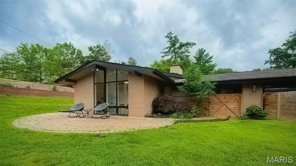 Beautifully reimagined Ralph Fournier mid-century modern ranch on nearly a half-acre in the desirable Sunswept subdivision. This 3BD/2BA home showcases iconic MCM features including a through-the-wall fireplace, floor-to-ceiling windows, skylight, and designer lighting throughout.

The exterior has been transformed with freshly painted brick, two modern garage doors providing access from both sides, custom entry doors, new asphalt driveway, professional landscaping, new sod, fencing, swales, French drains, and a rear retaining wall. A Japanese-inspired garden with rare maples and evergreens creates a peaceful retreat.

Inside, luxury vinyl flooring, fresh paint, modern baseboards, trough lighting, George Nelson pendants, LED cans, and architectural uplighting elevate the home’s mid-century aesthetic. The refreshed kitchen features stainless appliances, granite countertops, and a Delta Trask faucet. Stainless refrigerator, washer, and dryer stay.

Both bathrooms offer floor-to-ceiling Carrara marble, European floating vanities, European shower systems, bidet toilets, and Delta Trinsic fixtures. The primary bath includes heated floors and a towel warmer.

Additional upgrades: newer electrical panel, Lutron switches/dimmers, AT&T Fiber wiring, Nest thermostat, full insulation replacement, attic pipe heat wrap, and driveway wiring for future landscape lighting. Located in Ladue Schools and close to premier private schools, parks, dining, shopping, highways, Lambert Airport, and STL attractions. Includes 2-10 Home Warranty. Buyer to verify square footage. Sellers request closing with Elite Title LLC.