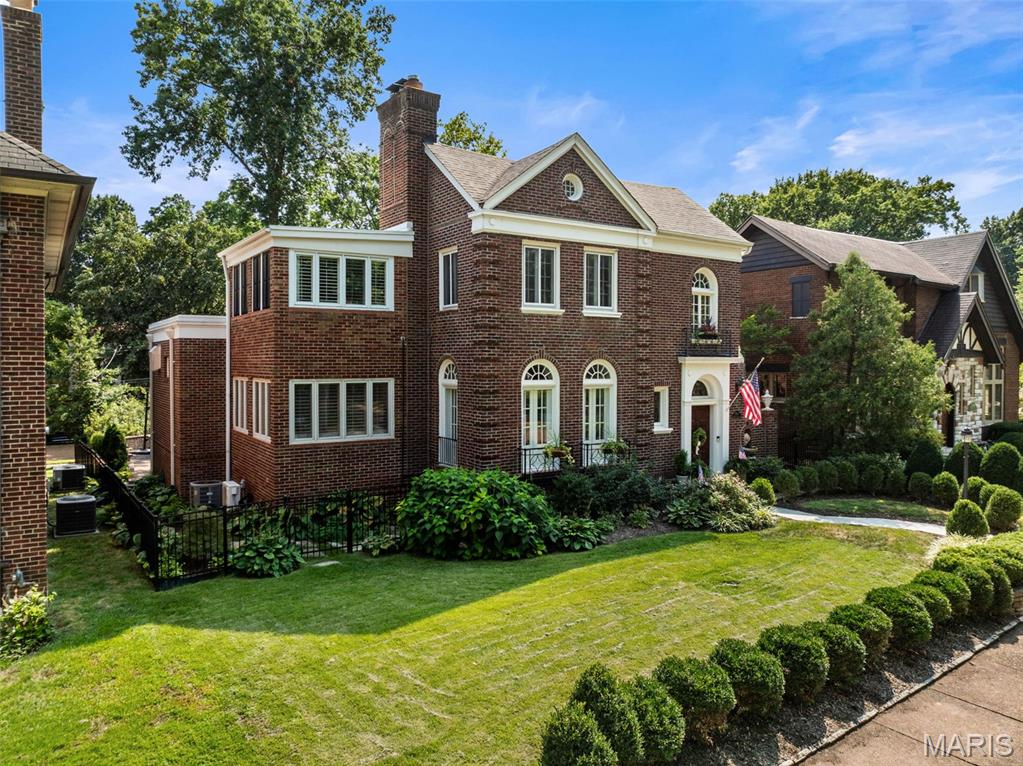 An exceptional expression of refined luxury in prestigious University Hills, this distinguished 4-bedroom, 3-bath residence seamlessly marries timeless architectural character with sophisticated modern living. Ideally situated within walking distance of Clayton, Forest Park, and Washington University, the property offers an extraordinary lifestyle defined by convenience, culture, and enduring elegance. A short few blocks to Flynn Park for tennis, playground, areas to run free. From the moment of arrival, the home’s architectural pedigree is evident in its exquisite original woodwork, graceful archways, French doors, rich hardwood floors, and three beautifully appointed fireplaces. Thoughtfully updated systems and an exceptional collection of designer lighting and finishes elevate the interiors while preserving the integrity and craftsmanship of the original residence. A beautifully appointed chef’s kitchen anchors the home’s expansive addition, creating an impressive setting for both intimate gatherings and grand-scale entertaining. The kitchen flows naturally to a private outdoor patio and meticulously landscaped grounds, extending the living space outdoors with effortless sophistication. Multiple dedicated office spaces offer exceptional flexibility for executive work, study, or private retreats. Elegant fencing and professionally curated landscaping provide privacy while enhancing the property’s distinguished presence. A rare opportunity to experience luxury living with historic soul in one of the area’s most coveted neighborhoods where architectural beauty, thoughtful modernization, and an exceptional walkable location converge.