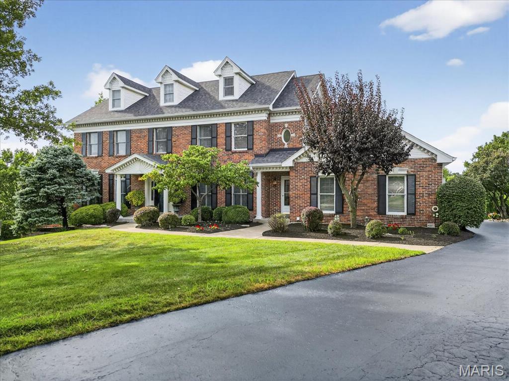 Nestled within Wildwood's prestigious Valley Estates, this magnificent 4 bedroom, 6 bathroom home epitomizes architectural excellence and sophisticated living. Spanning an impressive 4,550 square feet, this meticulously crafted 3 story home showcases uncompromising attention to detail including a new roof in 2024, a fully finished lower level with kitchen, office, spacious recreation area and fireplace. The thoughtfully designed floor plan seamlessly integrates formal and casual living spaces, creating an atmosphere perfect for both intimate gatherings and grand entertaining. Rich hardwood floors, soaring ceilings, and carefully curated architectural elements establish an ambiance of refined elegance throughout. The gourmet kitchen serves as the heart of the home, featuring premium appliances, custom cabinetry, and generous counter space that would make any culinary enthusiast swoon with delight. The luxurious primary bedroom suite provides a tranquil retreat, complete with spa-inspired ensuite bathroom and walk-in closet that rivals boutique dressing rooms. Three additional bedrooms offer flexibility for family, guests, or professional spaces, each thoughtfully positioned to maximize privacy and comfort. Located within a private community, residents enjoy proximity to, convenient shopping, restaurants, and more. This exceptional property embodies a lifestyle of distinction, where quality craftsmanship meets modern convenience in perfect harmony. Don't miss this rare beauty!