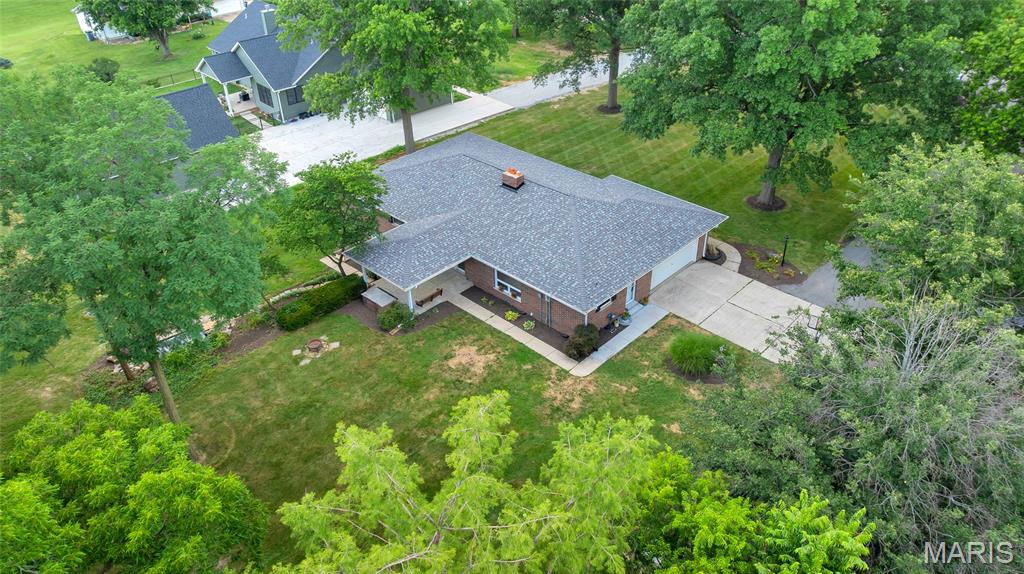 3/29 Open House Canceled. Nestled on 1.5 acres in the heart of Dardenne Prairie, this charming 1-story ranch offers privacy and tranquility with mature trees surrounding the property. The full masonry veneer exterior exudes timeless appeal, while the extended driveway provides ample parking. A serene koi pond, home to 40+ year-old koi, enhances the peaceful ambiance. Inside, the family room features a cozy wood burning fireplace, perfect for chilly evenings. The kitchen boasts granite countertops, updated cabinetry, and stainless steel appliances. The primary bath has been tastefully updated for modern comfort. Step outside to a covered back patio, ideal for relaxation or entertaining. A full, unfinished walk-out basement with a full bath and a newer water heater offers endless possibilities for customization. An outbuilding adds extra storage or workspace. This rare gem combines rural charm with prime location convenience—don’t miss this incredible opportunity!
Move-in ready with fresh Sherwin-Williams “White Dove” walls and clean white ceilings, new switches, outlets, plates, a new roof (June 2025), and updated landscaping 2025. Nearly 1,900 sq ft main level includes 3 beds, 2 baths, formal living room, and cozy family room with wood-burning fireplace.  Primary suite features two closets and an updated en-suite bath.
Picture windows flood the home with light and stunning property views. Hardwood floors lie beneath carpet in bedrooms and hallway, ready to restore. The walk-out basement with full bath is ready for finishing to your liking—media room, gym, guest suite, or more—offering massive equity potential.
Tucked on a quiet dead-end street, this home is perfect for comfortable living now—and luxury upgrades ahead.