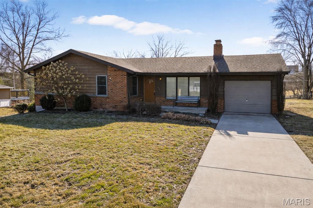 Discover the potential of this Charming, Warm and Welcoming, Brick & Cedar ranch home, situated on just over a half acre lot in unincorporated St Charles County (lower RE taxes), Located in the 5 Star rated Francis Howell School District this home offers 1240 sqft of main floor living space featuring a large livingroom, oversized eat-in kitchen, a master and 2 secondary bedrooms, all with double closets and one with a stackable laundry hookup, 1 full & 1 half  updated baths. There is an abundance of natural sunlight throughout the home with newer large vinyl tilt in windows, other features include white 6 panel doors, ceiling fans, updated light fixtures, hardwood floors, newer front and back doors, newer AC and roof oh, and did I mention CENTRAL VAC SYSTEM!!! Double your living space with a finish in the WALK OUT lower level which features a beautiful, masonry, wood burning fireplace, perfect focal point for a large family entertainment /rec room with room to spare for a workshop, A TON OF STORAGE on the full wall of built in shelving. LL also features an osmosis water system, water softener, sumppump/draintile system, a utility sink and a washer dryer that stays. Coming soon sound barrier wall in front of 364.
Unlock the potential of this spacious lot with a possible home addition, detached garage/workshop or a polebarn??  Coming soon sound barrier wall in front of 364.
AND..........NO HOA restrictions!! Don't miss out on all this property has to offer :)
