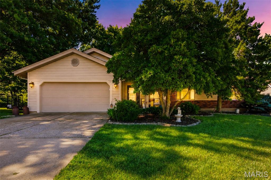 Welcome to this beautifully maintained ranch-style home tucked away on a quiet cul-de-sac in the heart of St. Charles. Offering approximately 2,350 square feet of living space, this 3-bedroom, 3-bath residence combines comfortable living with thoughtful updates throughout. The inviting open floor plan features a vaulted great room with a cozy gas fireplace, hardwood flooring, and abundant natural light. The updated kitchen showcases custom cabinetry, quartz/granite countertops, stainless steel appliances, a breakfast bar, and ample workspace for everyday living and entertaining.

The spacious primary suite includes a large walk-in closet and an updated bath with dual vanities and a walk-in shower. Two additional main-level bedrooms, a full bath, main-floor laundry, and a welcoming foyer provide convenient single-level living. The finished lower level adds valuable living space with a recreation area, bar, half bath, and extensive storage options.

Situated on a fenced lot of nearly ¼ acre, the outdoor space features a large patio, mature landscaping, and plenty of room to relax or entertain. Additional highlights include a two-car attached garage, updated HVAC system, newer roof, underground utilities, and low HOA fee. Conveniently located near shopping, dining, parks, schools, and major commuter routes, this move-in-ready home offers the perfect blend of comfort, style, and location.