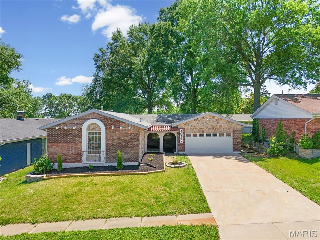 OPEN SAT 1-3PM | WOW! One of a kind place to call HOME - This stunning 3 bedroom 2.5 bath updated ranch home offers over 2,400 livable sqft with more room to grow, an attached two car garage, beautiful fully fenced backyard & sunroom+++  Great curb appeal leads with a big front yard and charming arched iron gates welcome you to the inside of this gorgeous home. Inside you'll be greeted by an entrance foyer with a closet leading you to the spacious living room with beautiful hardwood flooring & big windows. Designated dining room area. The big kitchen offers lots of cabinetry, new stainless steel appliances incl. dishwasher and has beautiful breakfast nook. Large family room with a fireplace and custom built-ins lead you to the HUGE back sunroom. Perfect for cozy mornings, family gatherings+++ This awesome sunroom also leads you to your private backyard oasis featuring a back deck and a fully fenced-in, level yard. There are three great sized bedrooms on the main level, an updated full bathroom and a primary main floor suite with a walk-in closet! Downstairs you'll find a fully usable lower level with a large recreation/ family room with a half bath and a bonus room - could be another sleeping room, office, gym/ workout space+++ Separate utility/ laundry room for extra storage on the other side of the basement. Convenient attached oversized, two car garage with additional room for storage. Move-In Ready for you - comes with a passed occupancy! Location, location - tucked away in a quiet neighborhood, yet close to all highways, schools, parks, shopping & restaurants. Easy access to St Louis City, STL airport and more. CALL NOW