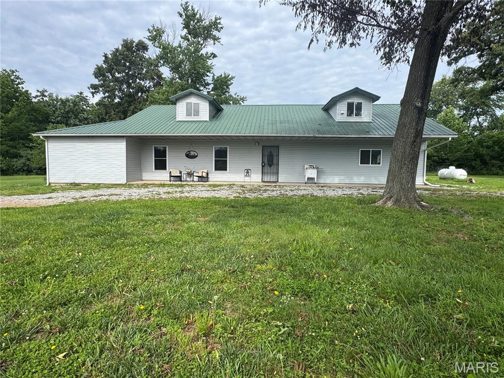 Country properties like this are hard to find! Situated on 32 beautiful wooded acres, this remodeled 2-bedroom, 2-bath home offers over 2,400 square feet of living space, endless possibilities, and the privacy you've been searching for.

Over the past few years, the home has undergone extensive renovations, including updated electrical, new HVAC, upgraded bathrooms, fresh paint, new lighting, laminate flooring, and new appliances. The result is a move-in-ready home that perfectly blends modern updates with country charm.

Step through the front door into a spacious open-concept living, dining, and kitchen area that's perfect for entertaining family and friends. The kitchen features a farmhouse sink, abundant cabinet space, and a layout designed for both functionality and style.

The primary bedroom is conveniently located just off the living room and includes a private ensuite bath. A second generously sized bedroom provides comfortable accommodations for family or guests.

One of the most attractive features of this property is its flexibility. Two unfinished rooms provide a blank slate for a home office, hobby room, additional bedrooms, or whatever best fits your needs. Just off the living room is an impressive 740-square-foot space that could serve as a large family room, luxurious primary suite, game room, or be divided into multiple bedrooms. Upstairs, the 462-square-foot attic area offers even more possibilities for expansion, recreation, or storage.

Enjoy peaceful mornings and relaxing evenings from the covered front and back porches while taking in the sights and sounds of the surrounding woods. The 32 wooded acres provide opportunities for hunting, hiking, recreation, or simply enjoying nature right outside your door.

Hunters will appreciate the excellent deer and turkey populations that thrive on this property. The rolling terrain naturally creates travel corridors, funnels, pinch points, and bedding areas that can be strategically utilized to maximize hunting success. An established trail system provides quiet and convenient access throughout the property, making it easy to reach stand locations and enjoy the outdoors.

A pond provides a reliable water source for both wildlife and livestock while adding to the property's scenic appeal. For those interested in farming or raising animals, the livestock barn features a built-in chicken coop along with ample space for horses, cattle, or other livestock. Combined with the acreage, this property offers an excellent opportunity for a hobby farm or small livestock operation.

For those who need extra workspace or storage, the property includes a massive 2,200-square-foot workshop/storage building that's ideal for equipment, vehicles, projects, or the ultimate workshop.

Properties offering this combination of updated living space, quality outbuildings, hunting opportunities, recreational acreage, and country privacy rarely become available. Schedule your private showing today before this one is gone!
