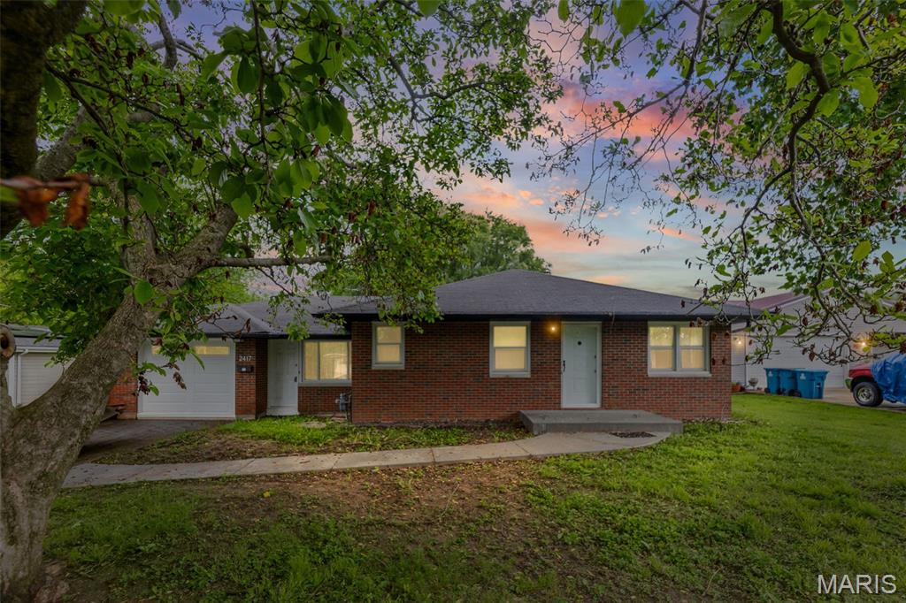 This full brick home with attached one car garage and breezeway on over a quarter acre lot in an area convenient to interstates, schools, shopping and hospitals. This home offers a large and lovely living room with hardwood floor and lots of natural lighting, 2 nice sized bedrooms each with hardwood floors and double sized closets, a bathroom recently updated with a walk in shower, a nice large and bright kitchen with eat-in dining area and includes electric range and newer refrigerator.  Washer and dryer can stay.  The yard is 80x150 and has a partial privacy fenced in area in the back.  The basement is a walk-up and the stairs were recently covered with wood platform access for safety and keeps leaves from gathering by the basement door.  Basement has been unmodeled but would add additional living space if re-finished, and there is a bathroom plumbed in ready to be updated.